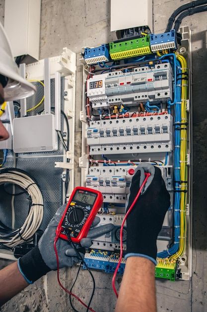 Technician checking household electrical wiring